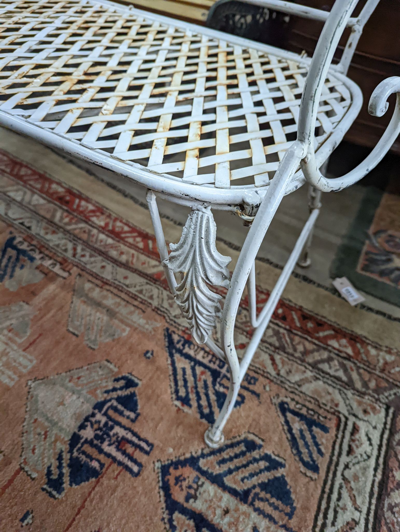 A French wrought iron garden bench, length 135cm, depth 50cm, height 96cm